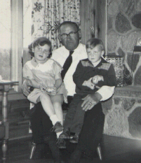 Roy Badgero holding Lynn & Allen Bowers